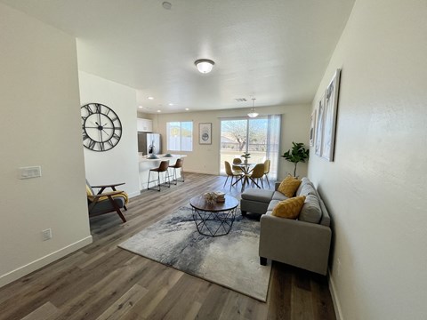 the living room of an apartment with a couch and a table